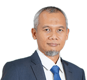 A man wearing a suit and tie stands in front of a black background. AI generated content