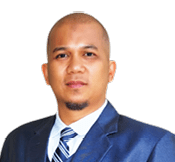 A man wearing a blue suit and tie stands in front of a white background. AI generated content