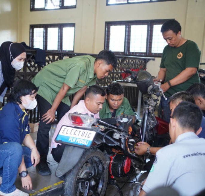 A group of people are gathered around a motorcycle, with some of them wearing masks. They appear to be working on the motorcycle, possibly fixing it or discussing its features. The scene takes place in a room with a dining table and chairs nearby. AI generated content