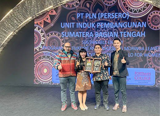 Three people are standing on a stage, holding trophies. AI generated content