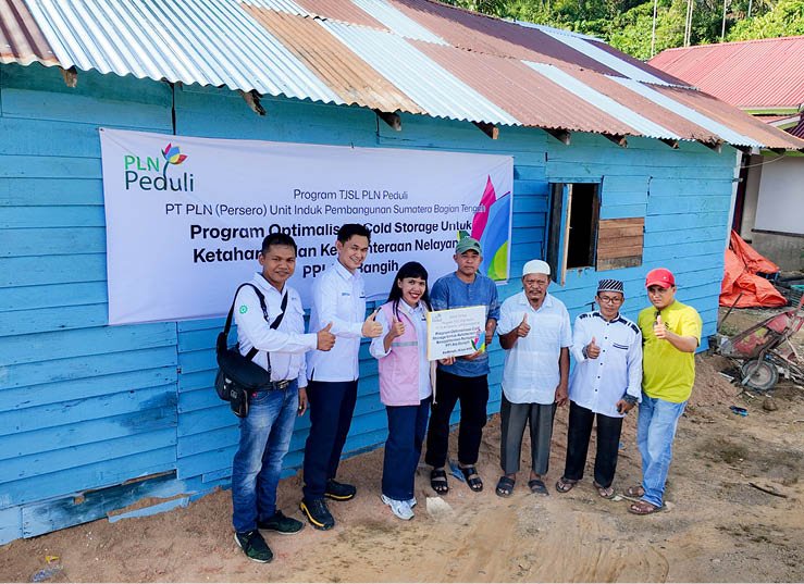 A group of people are standing in front of a blue building, posing for a picture. AI generated content